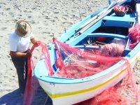 Fisherman cleaning nets